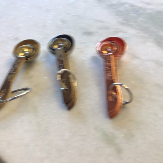 gold measuring spoons