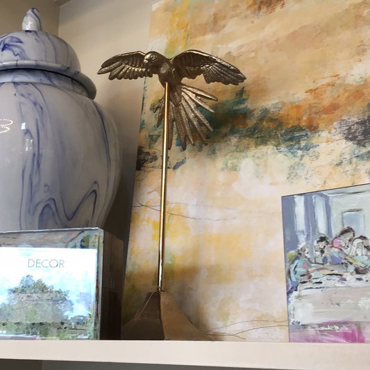 Flying bird on stand