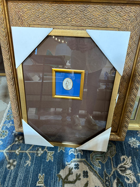 Framed print with oval medallion