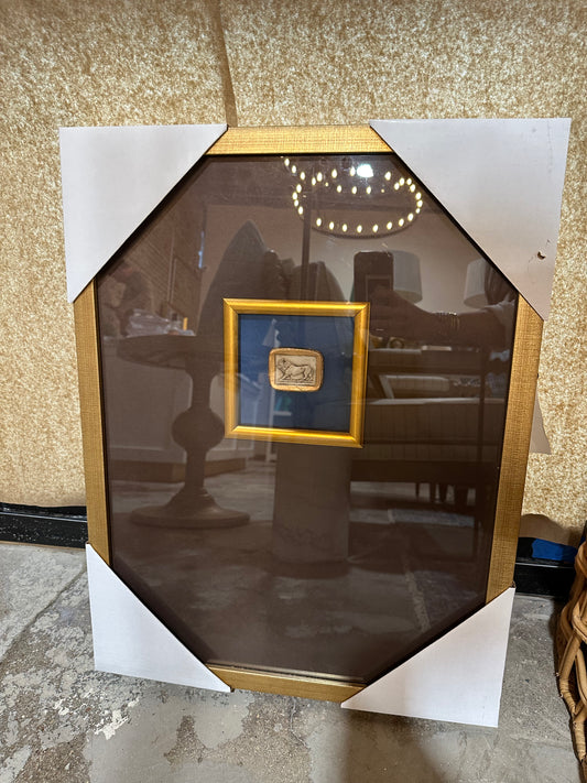 Framed print with lion medallion